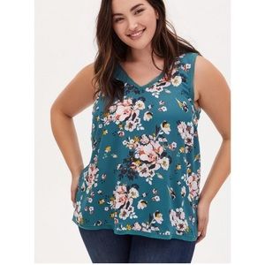 Torrid, EUC, 3X. Raw edge, sleeveless teal floral blouse.